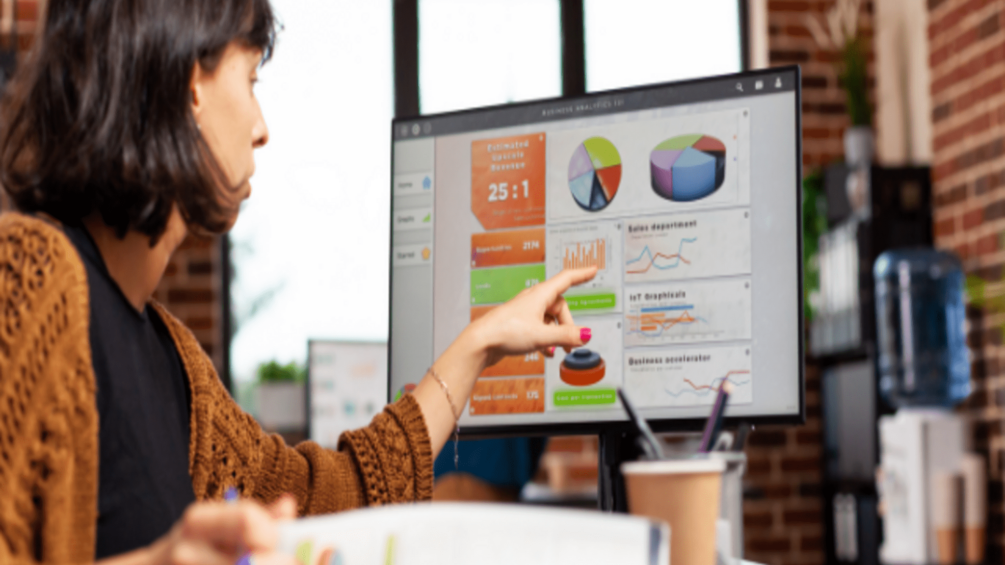 Woman looking at Analytics Dashboard on PC